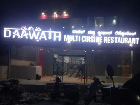 Illuminated 3D letters on a multi-cuisine restaurant