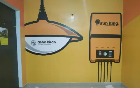 Painted wall branding with a lamp and solar product graphic